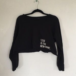 Black “less is the new more” crop sweatshirt